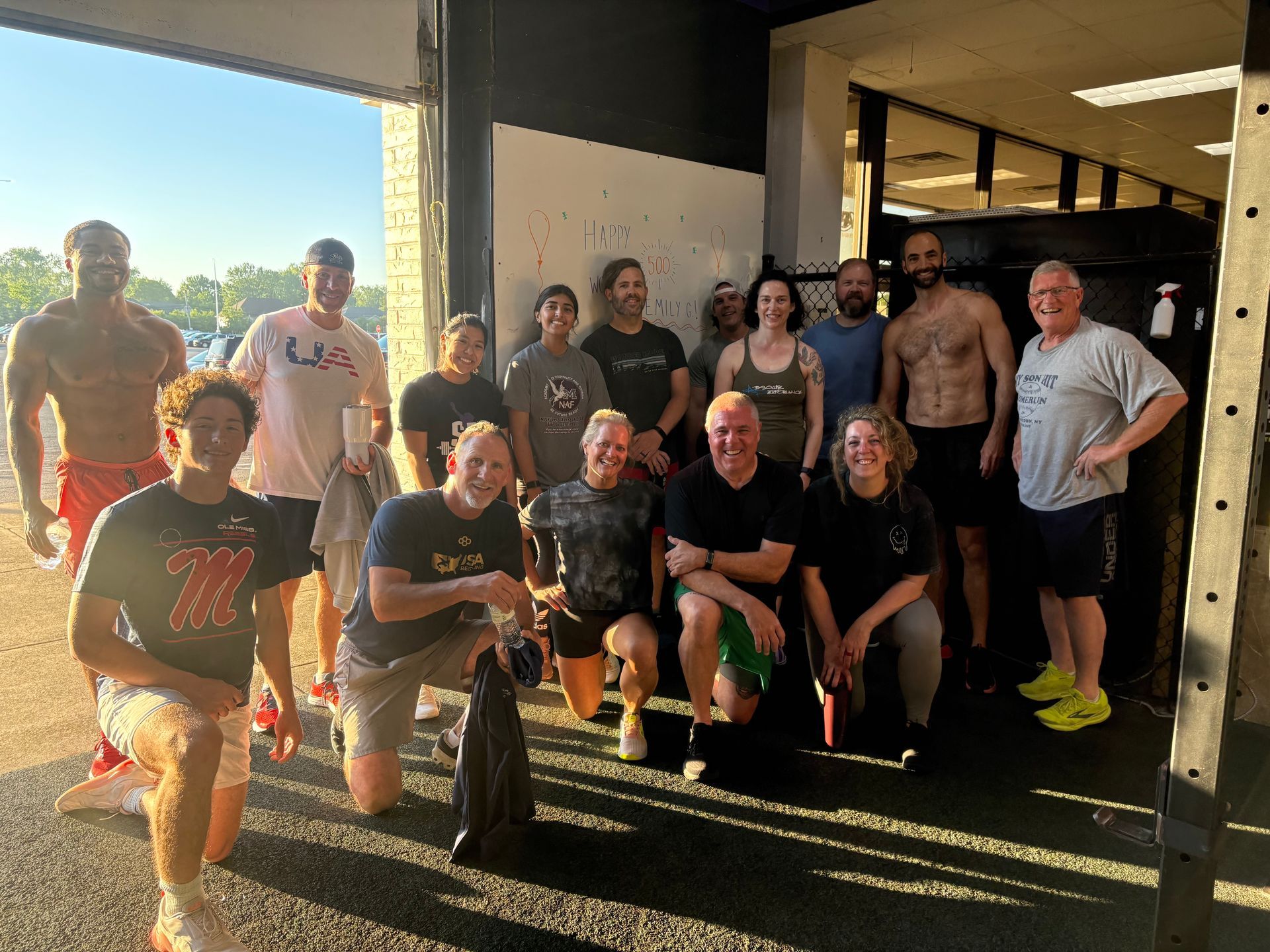 Family doing fitness workout together in summer with kids and parents