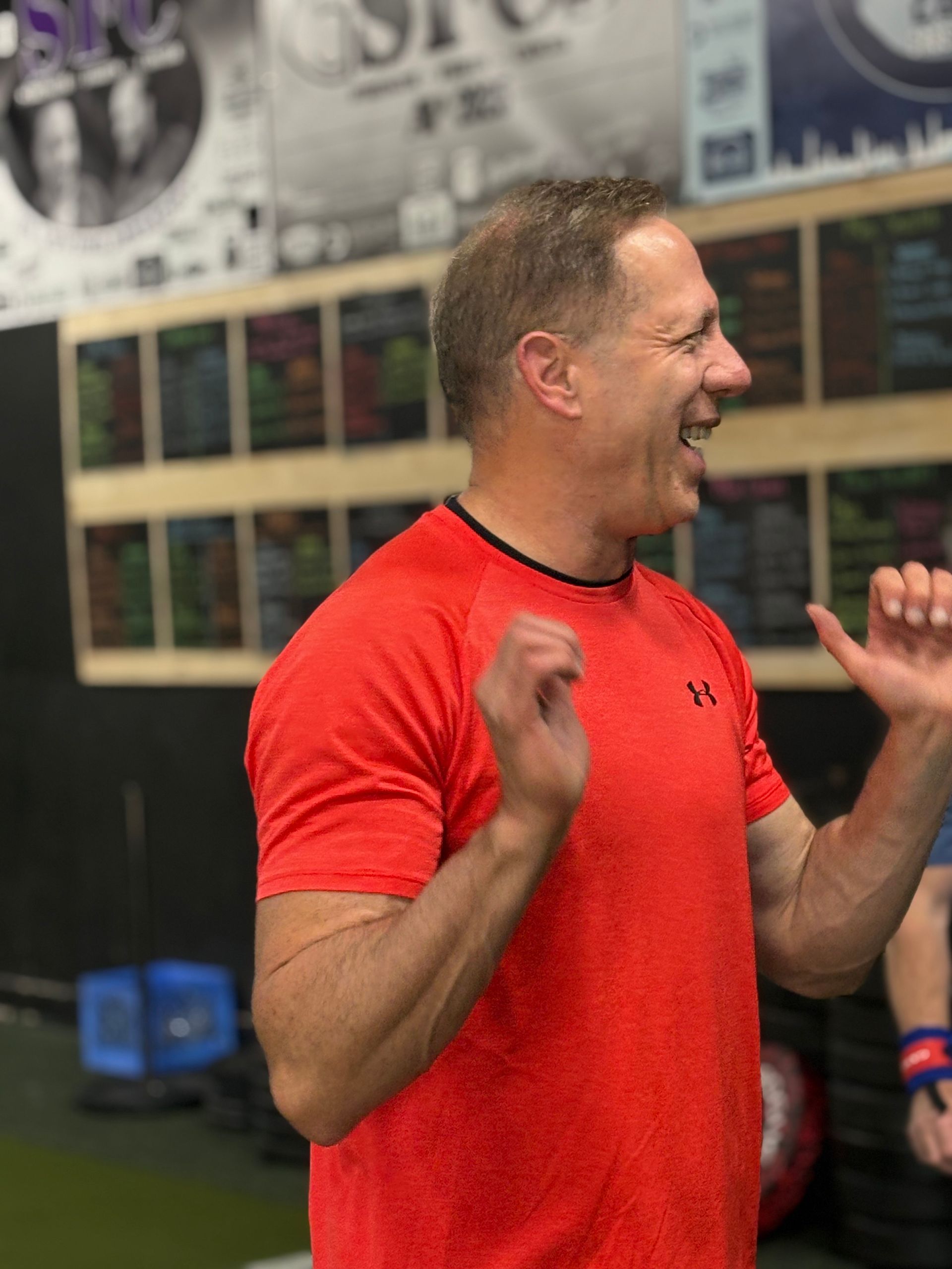 Personal trainer helping client with strength training workout