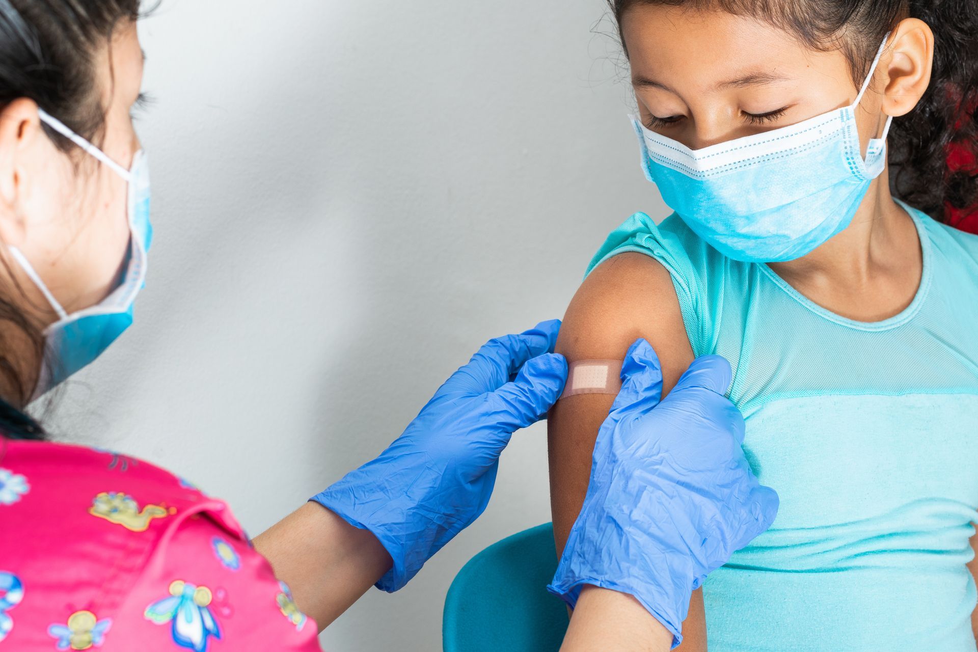 Nurse giving a child a vaccine
