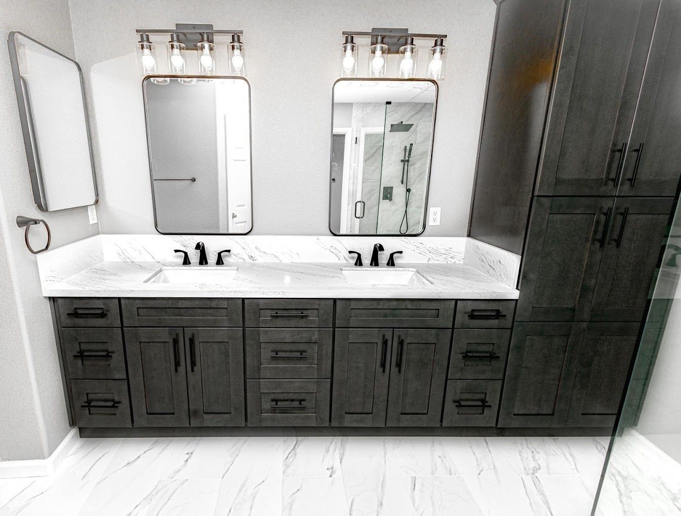A bathroom with two sinks and two mirrors.