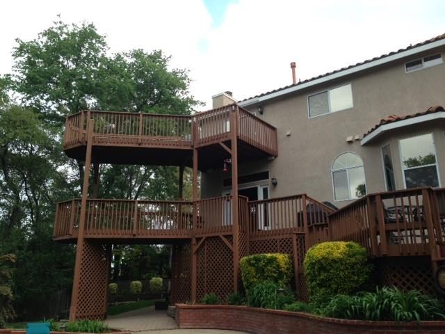 A large house with a large wooden deck