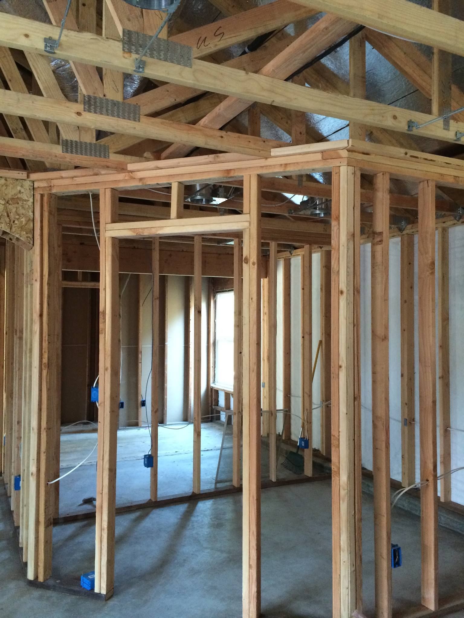 A room that is being built with wooden beams