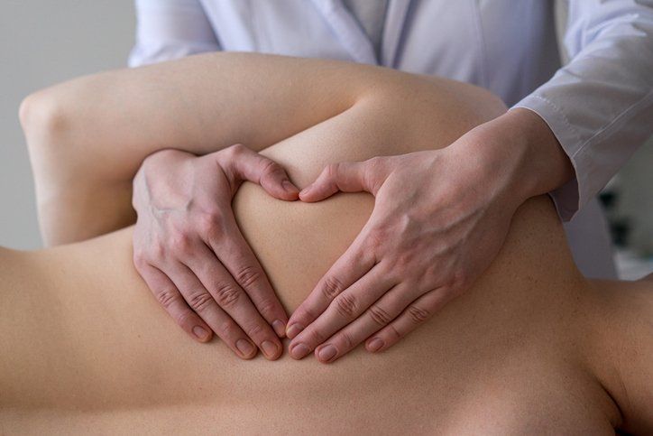 Closeup of Osteopathic Masseur Massaging Patient's Back | Dapto, Nsw | Dapto Physiotherapy & Sports Injury Clinic
