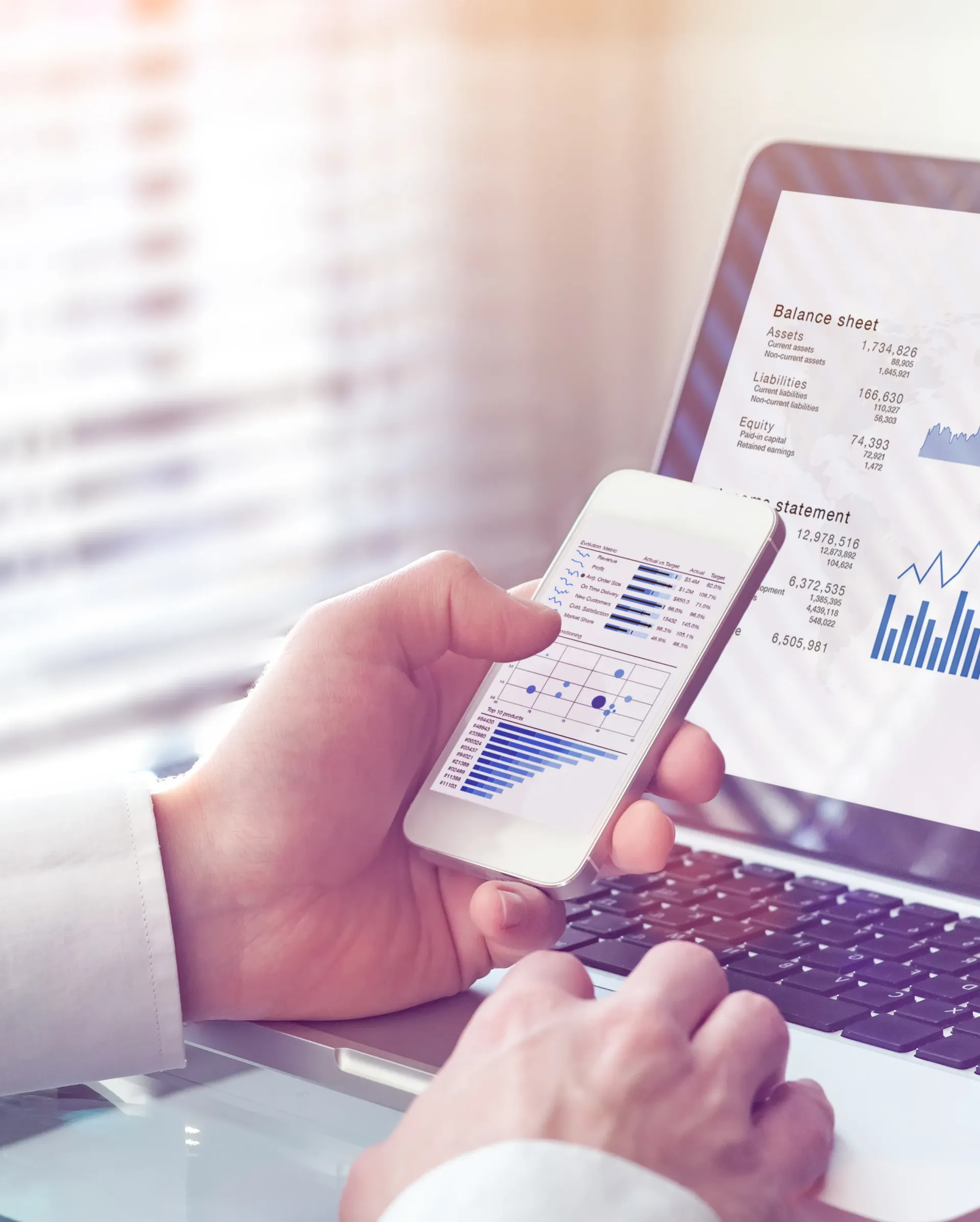 An Accountat Assessing Data on Mobile and Desktop Computer — SDM Accounting & Taxation Services In Cooroy, QLD