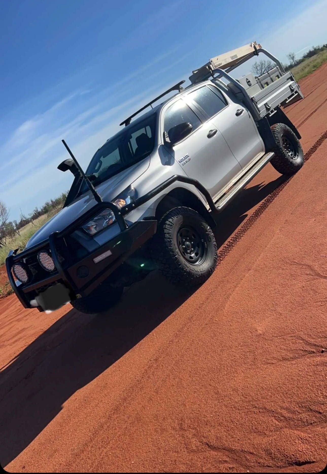A silver ute parked on red dirt — Alice Springs Electrical Services In Araluen, NT