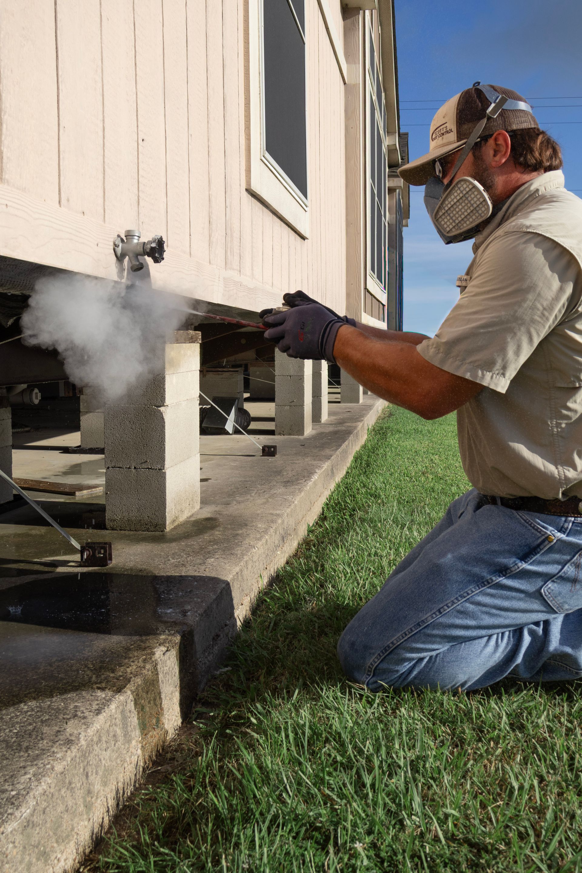 Man Disinfects Apartment in a Protective Suit — East Bernard, TX — Scott's Pest Control