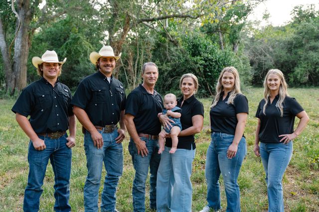 Blue Collar Workers Examine Building Wall — East Bernard, TX — Scott's Pest Control