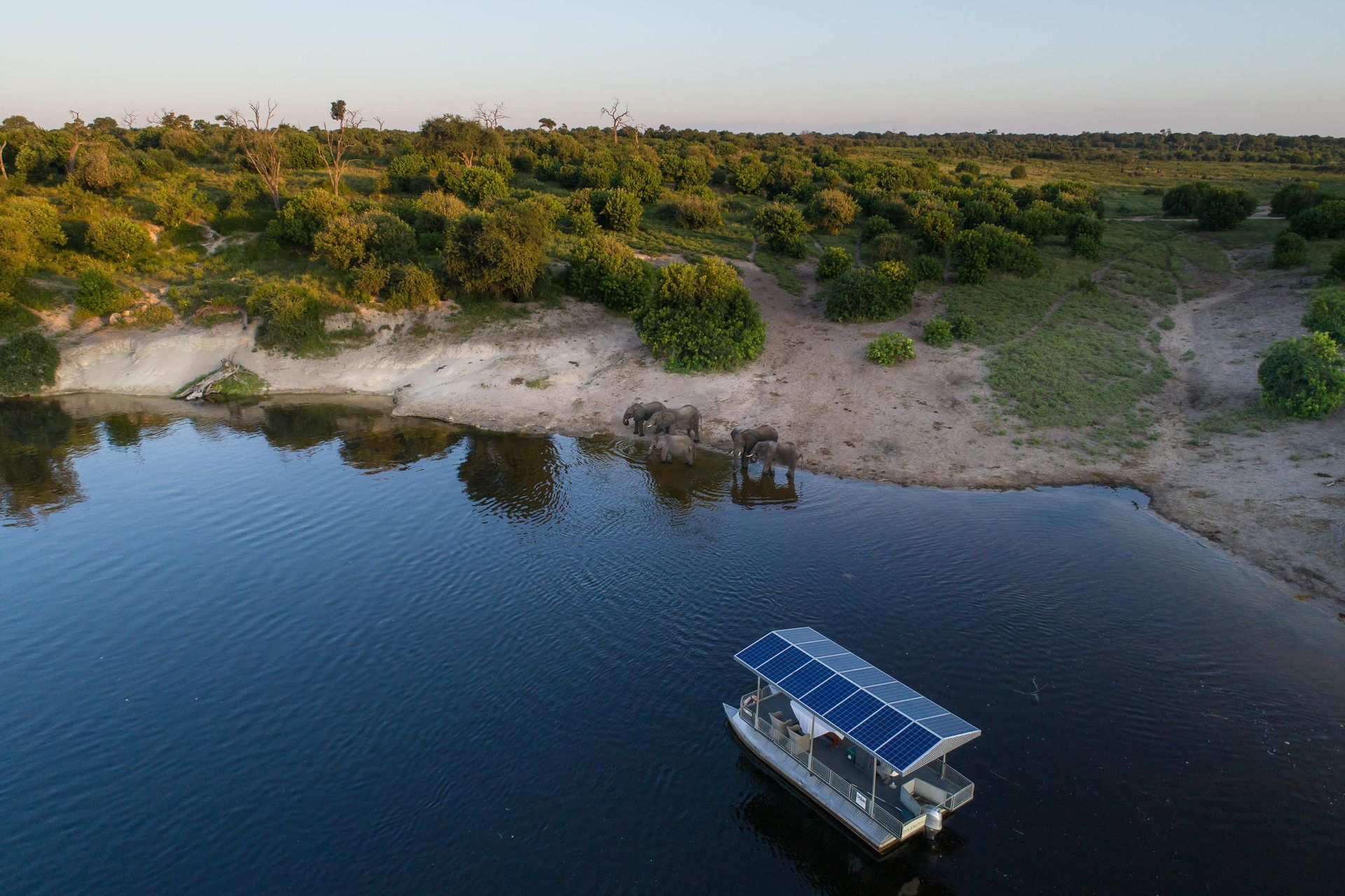 An aerial view of a boat floating on top of a lake.