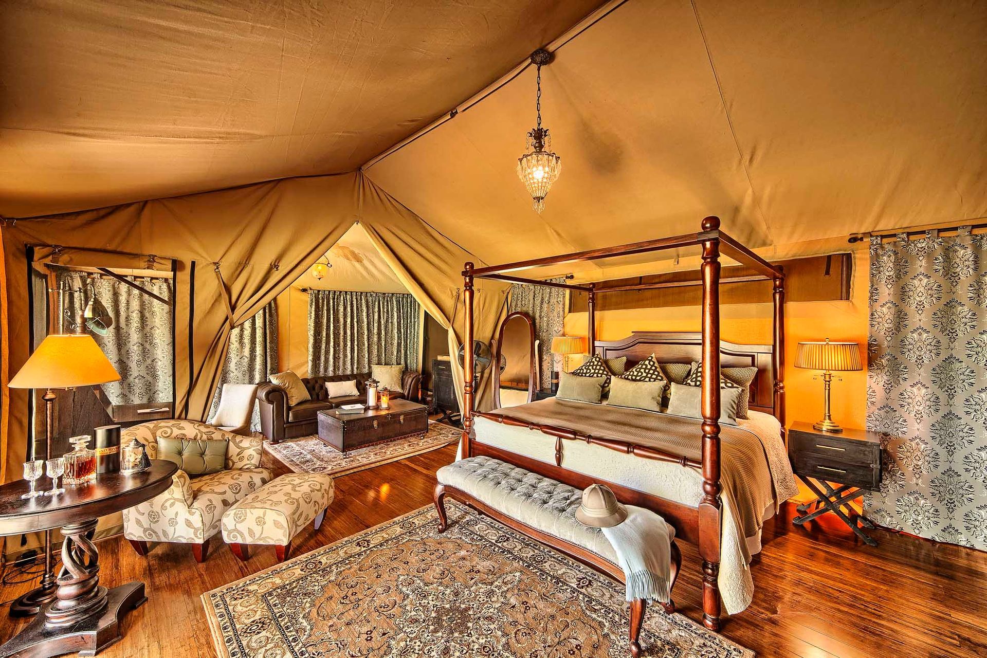 A large room with a canopy bed and a rug