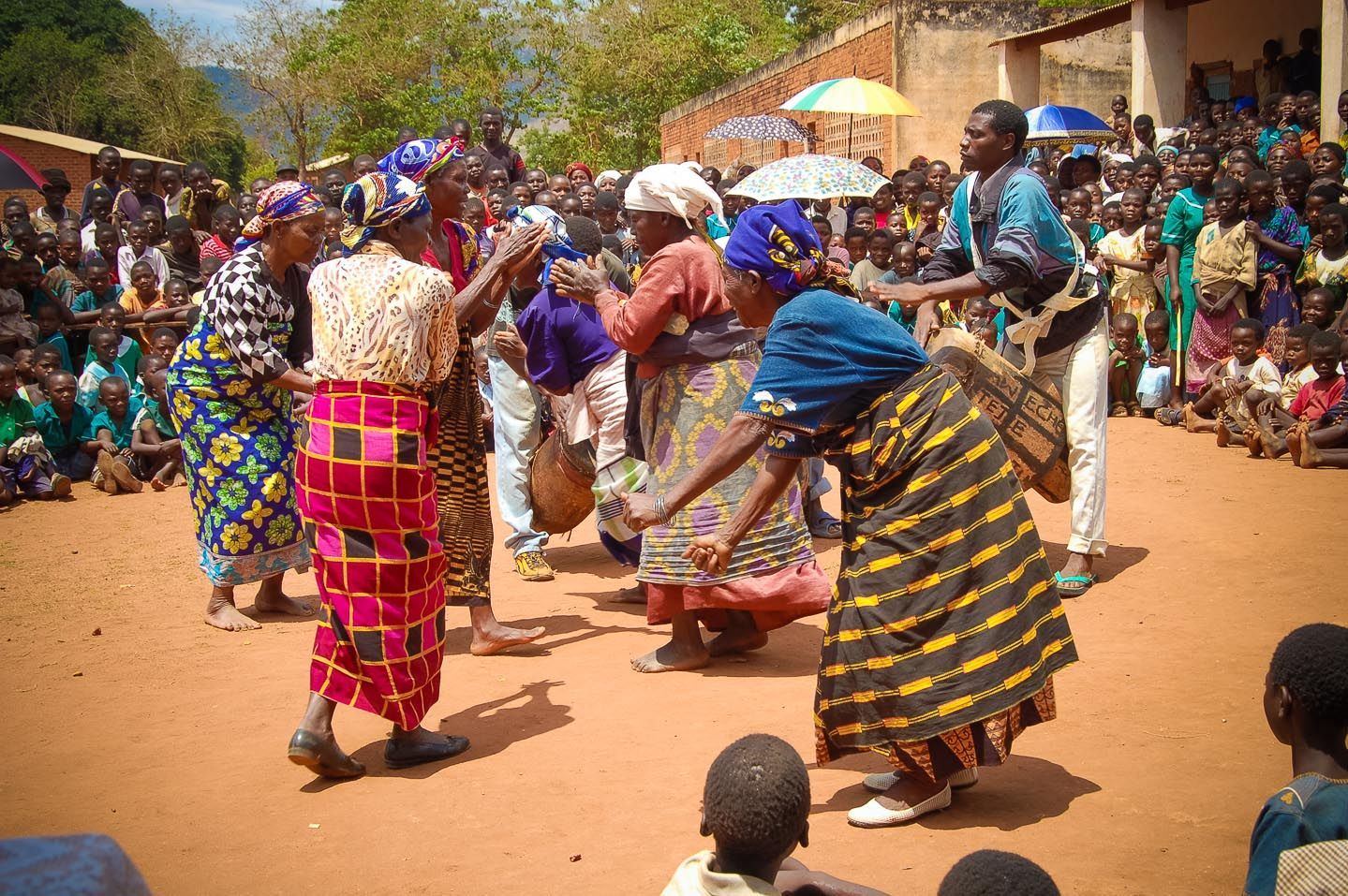 A group of people are dancing in front of a crowd.