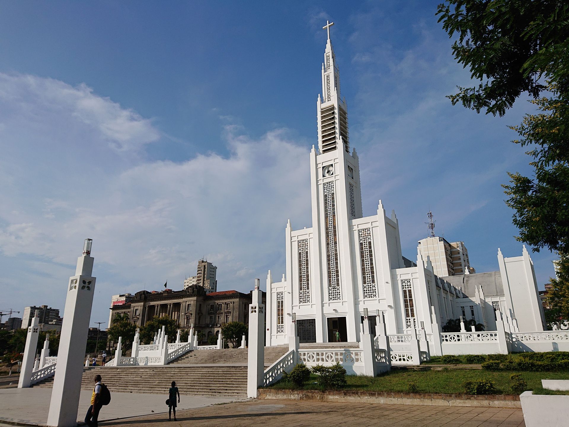 A large white church with a cross on top of it