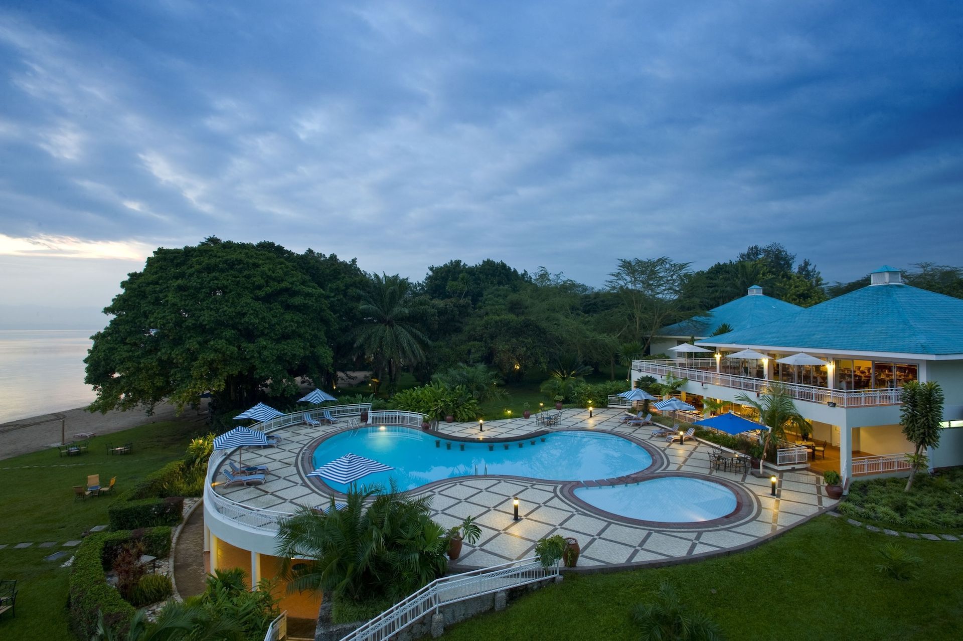 An aerial view of a resort with a large swimming pool