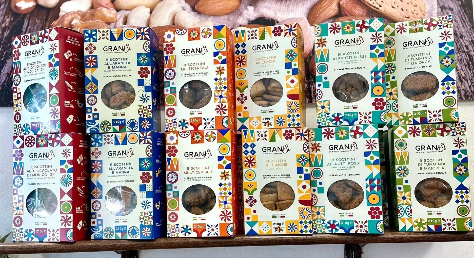 Assorted colorful packaged gifts arranged in rows on a store shelf display