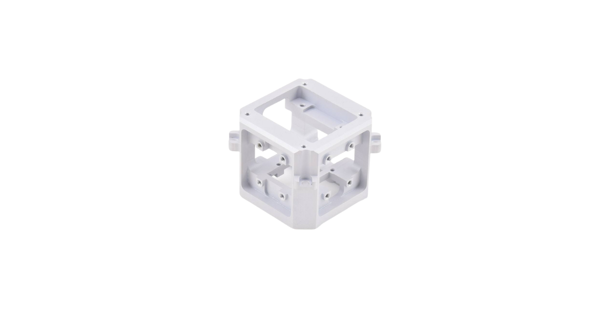 White, cube-shaped robotic frame with open sides and multiple mounting holes.