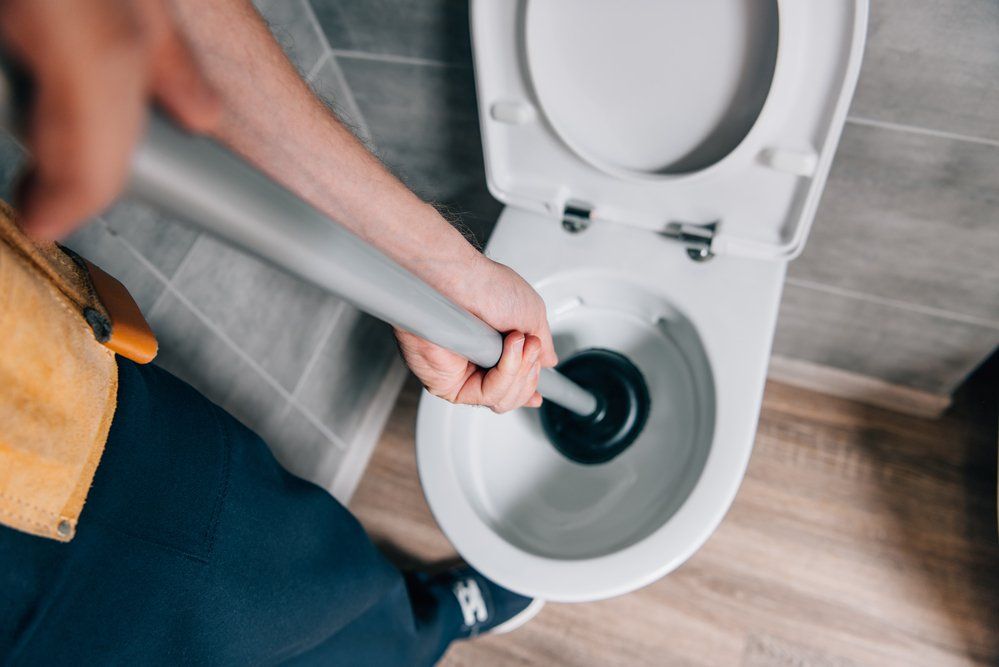 unclog drain using plunger- Drain Brain LLC