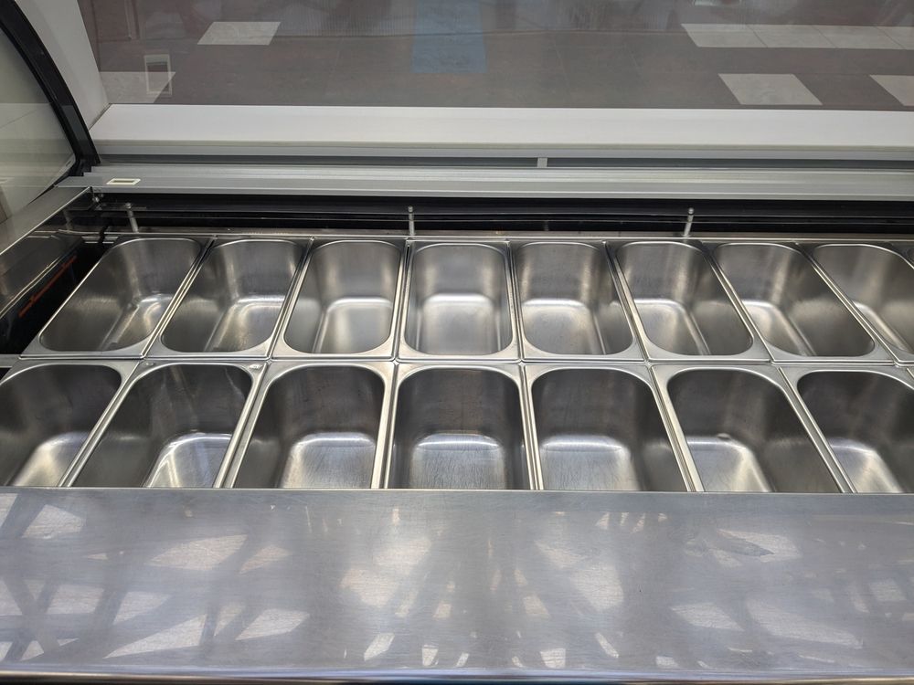 A well-organized stainless steel food storage unit.