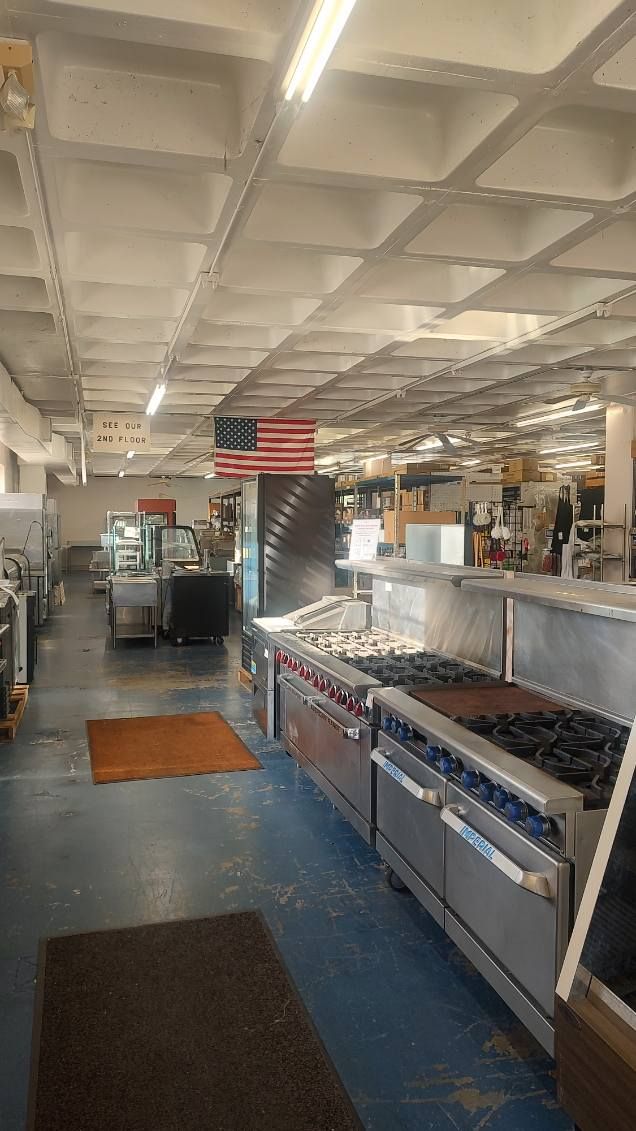 A large room filled with lots of stainless steel appliances.