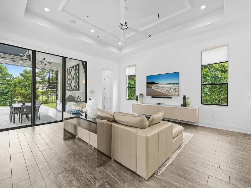 Bright modern living room with tan sofa