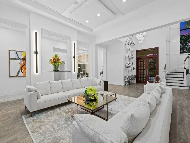 Bright living room with white sofas