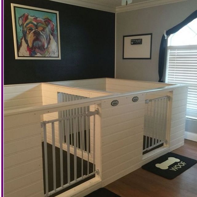 A custom wooden pet kennel with two gated sections, featuring a bulldog art print on a black wall and a 