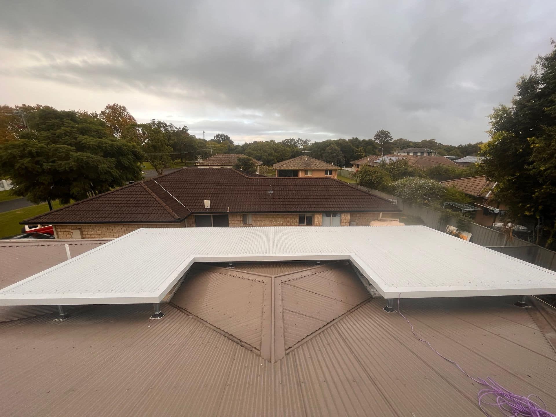 A Silver Metal Roof of a Building — Eli Mcauley Constructions in Byron Bay, NSW
