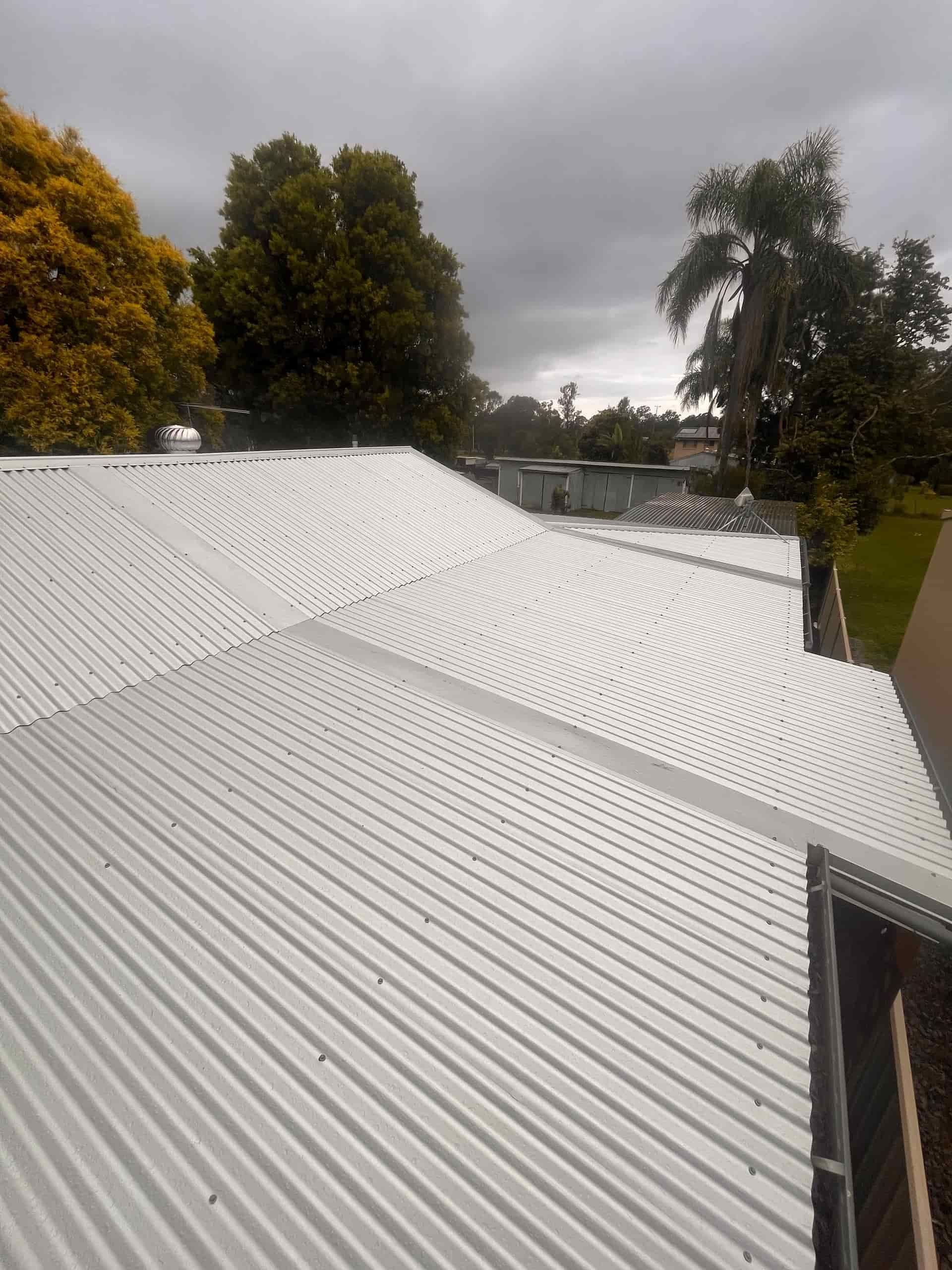 A Wooden Deck Surrounded by White Rails — Eli Mcauley Constructions in Lismore, NSW
