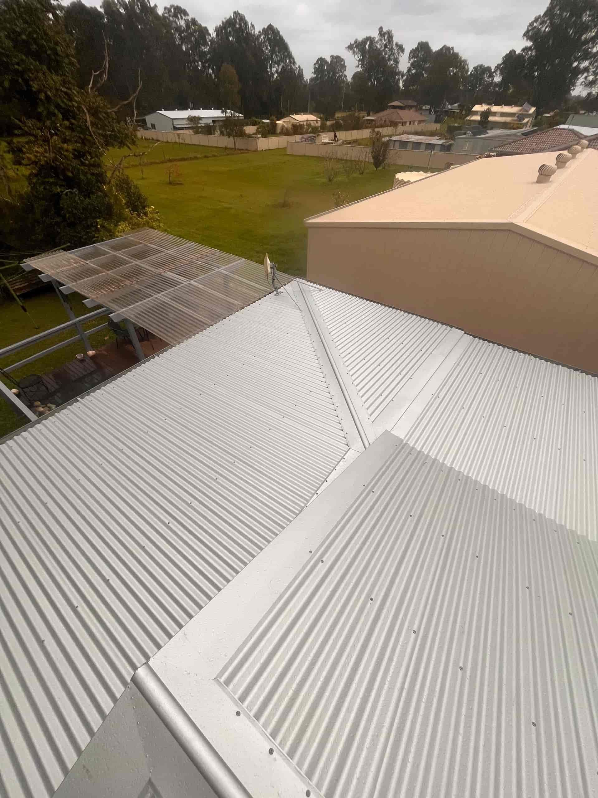 The Roof of a Building With Trees in the Background — Eli Mcauley Constructions in Macksville, NSW