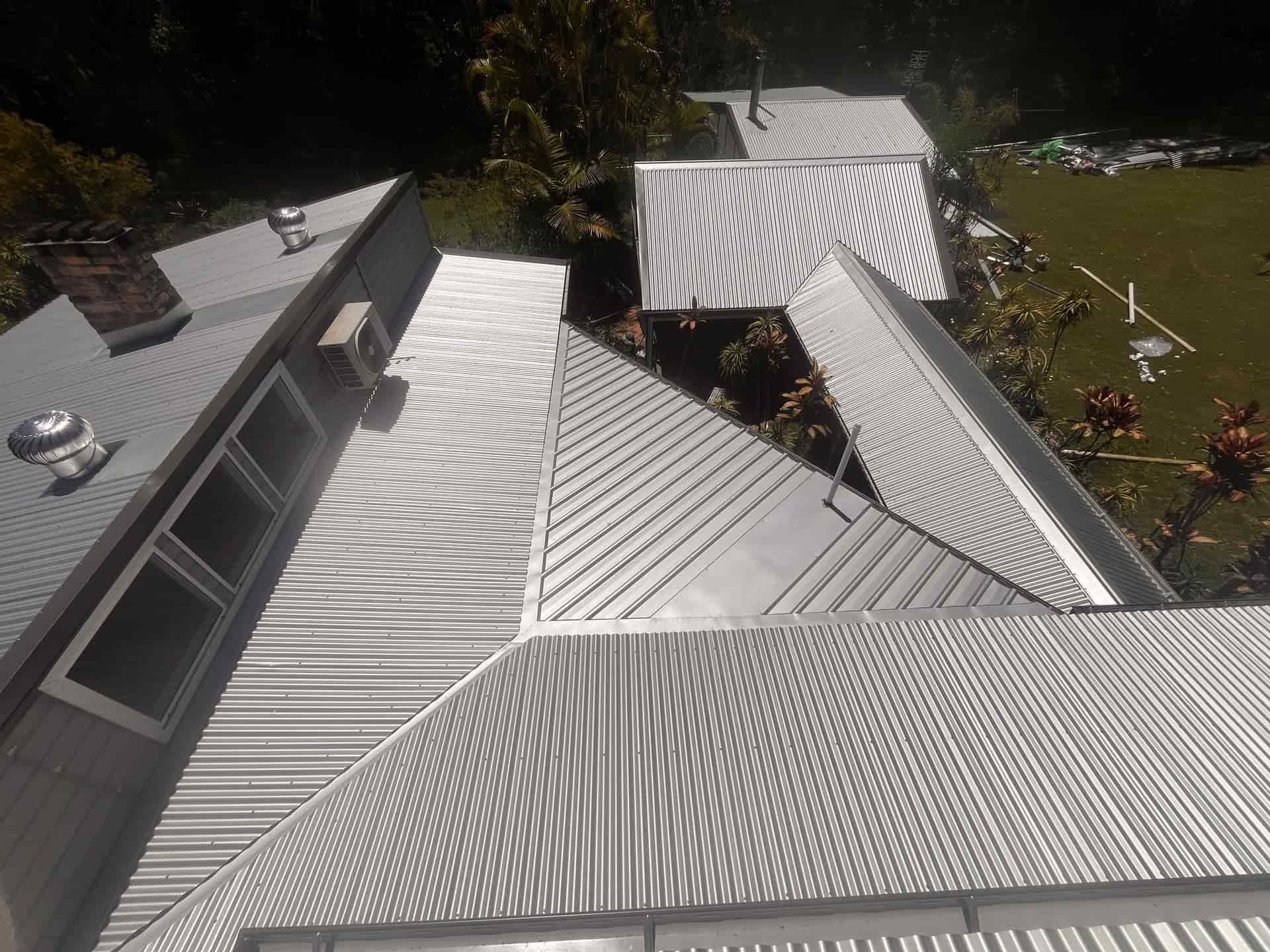 A House With a Wooden Deck and a Table and Chairs on It — Eli Mcauley Constructions in Grafton, NSW