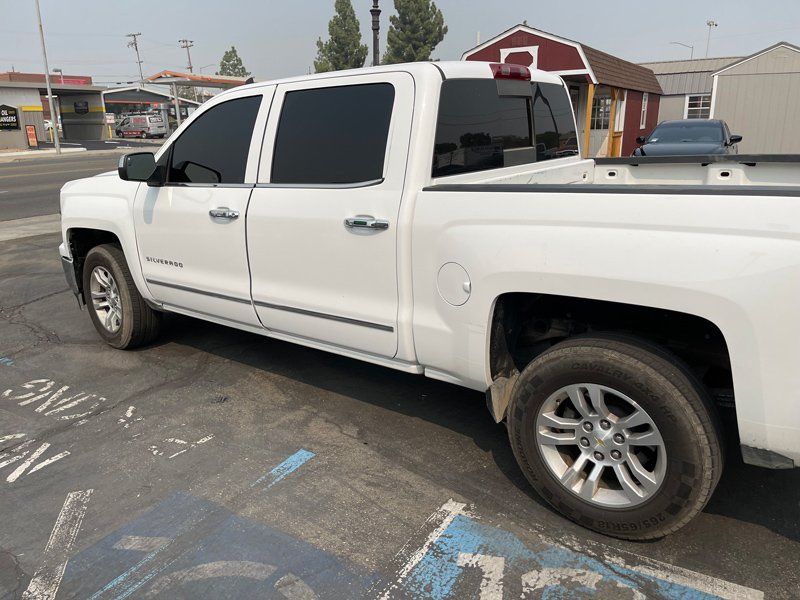 Black Tinted Glass In White Car — Fresno, CA — Precision Window Tinting