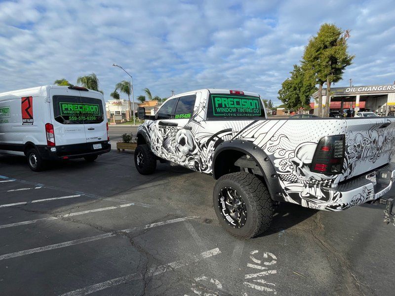 Logo In The Car Window — Fresno, CA — Precision Window Tinting