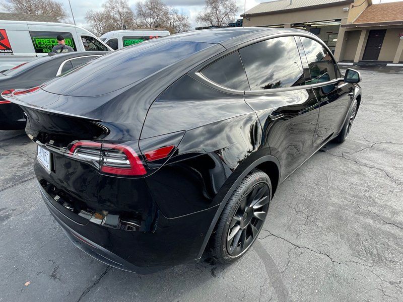 Shiny Black Car — Fresno, CA — Precision Window Tinting