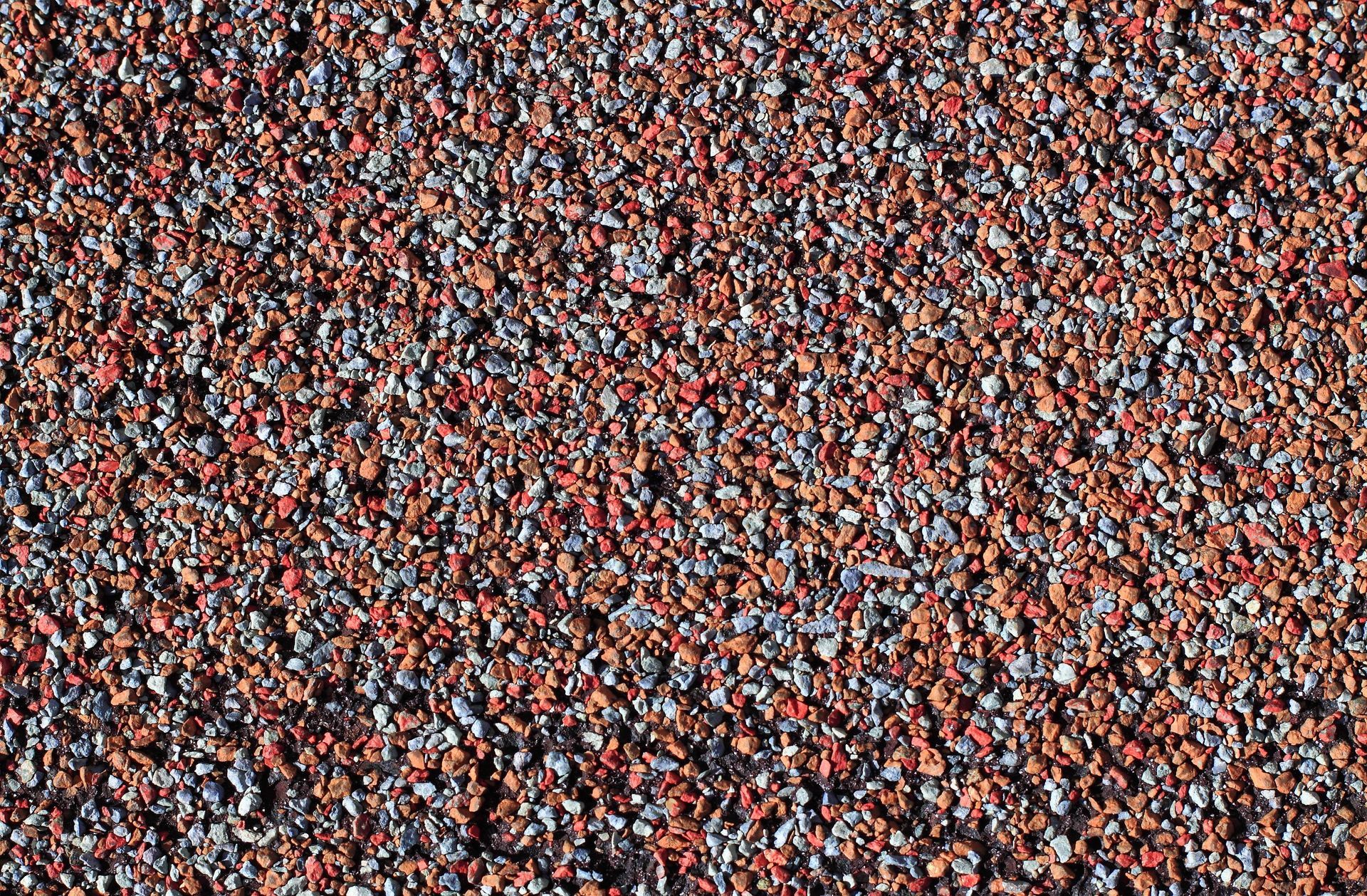 Close-up of aging asphalt shingle granule wear