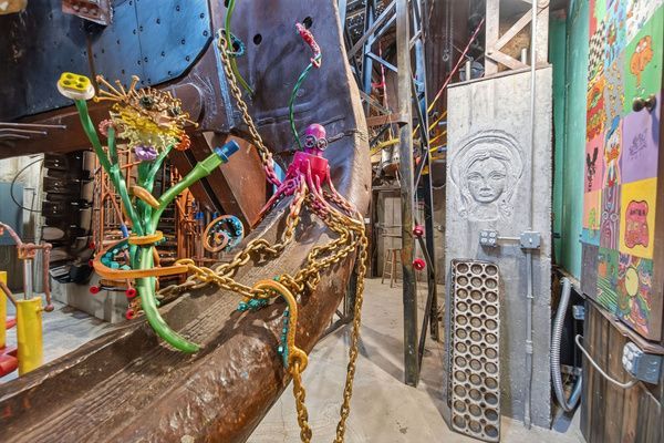 Industrial metalwork and mosaic sculpture by artist Tom Kirk inside The House on Garling in Bloomington, IL