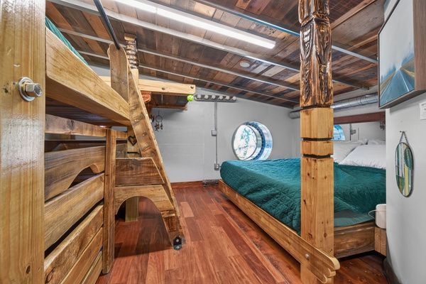 Bedroom with sculptural wall piece and warm natural light