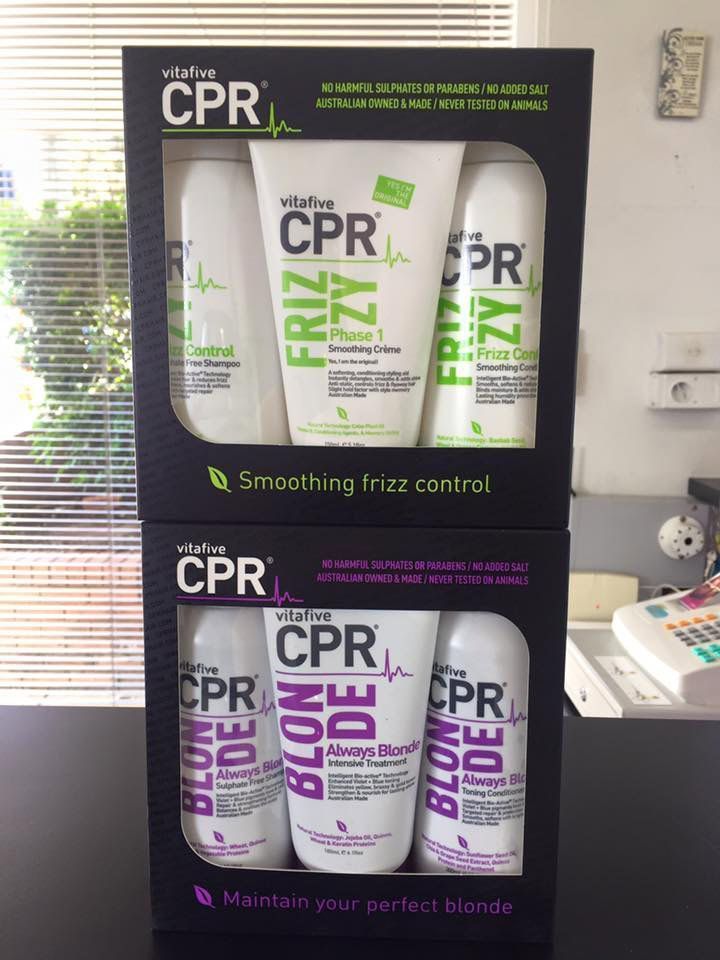 Two Boxes of CPR Hair Products Are Stacked on Top of Each Other — Lush Hair Studio in Tumbi Umbi, NSW