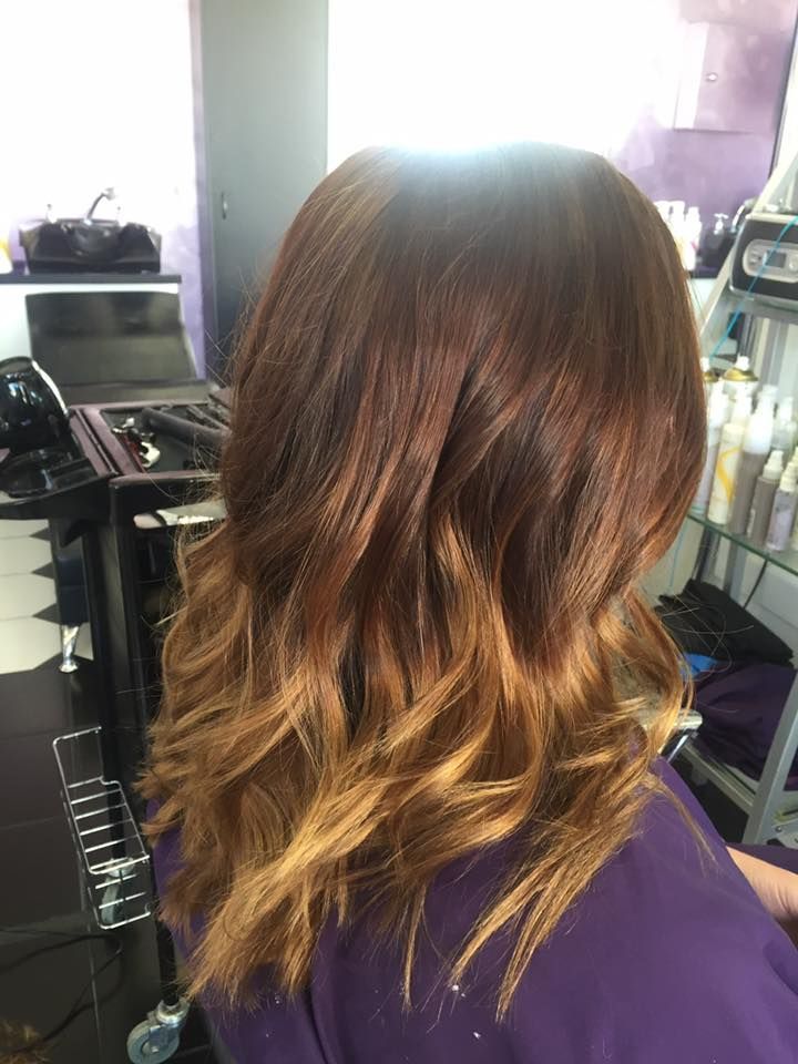 A Woman With Long Brown Hair is Getting Her Hair Done in a Salon — Lush Hair Studio in Tumbi Umbi, NSW