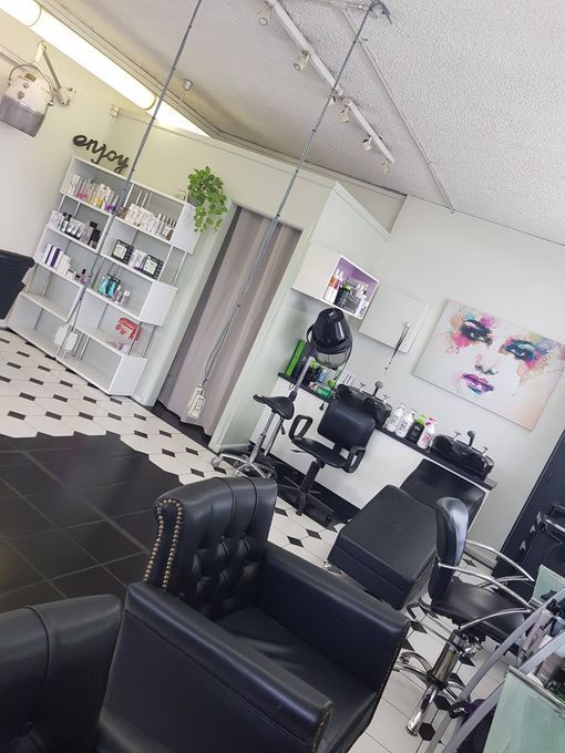 A Salon With a Painting of a Woman 's Face on the Wall — Lush Hair Studio in Tumbi Umbi, NSW