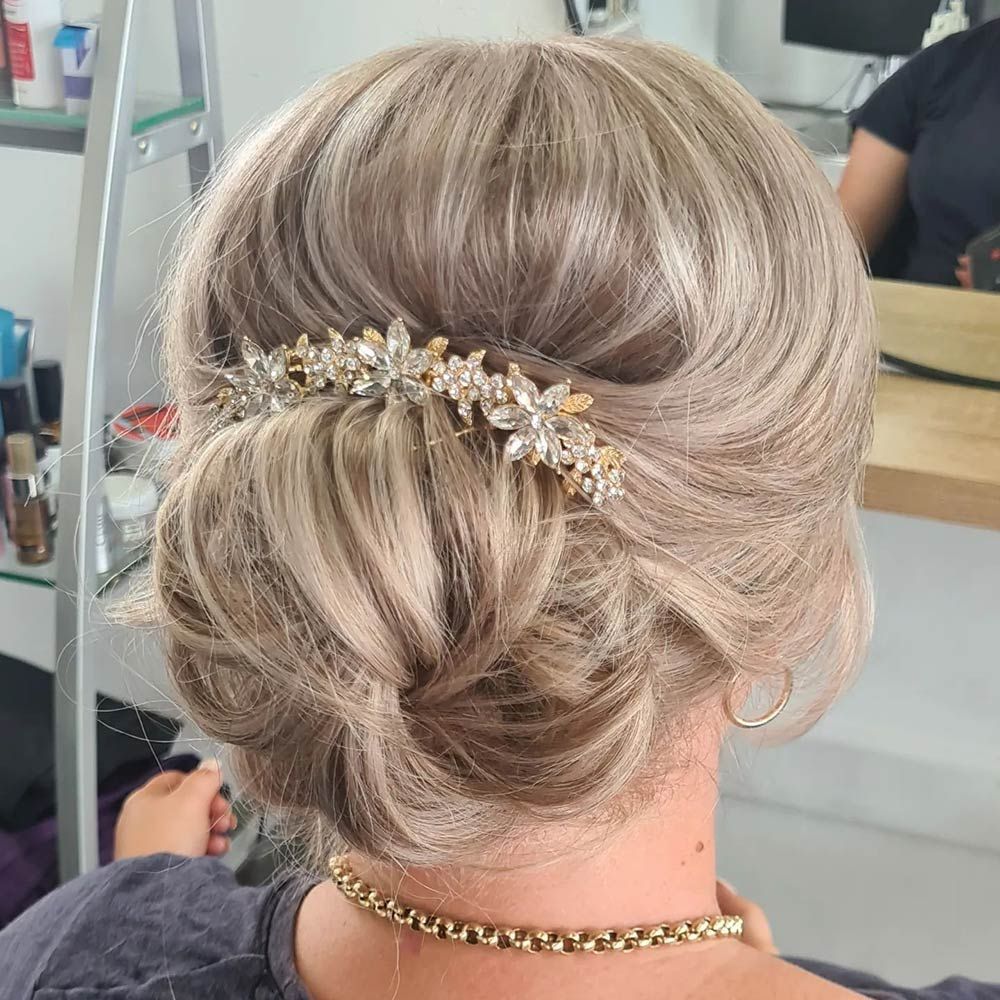 A Woman is Wearing a Bun With a Comb in Her Hair — Lush Hair Studio in Tumbi Umbi, NSW