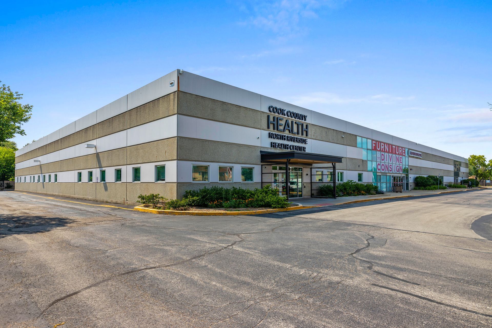 A large building with a lot of windows is for sale.