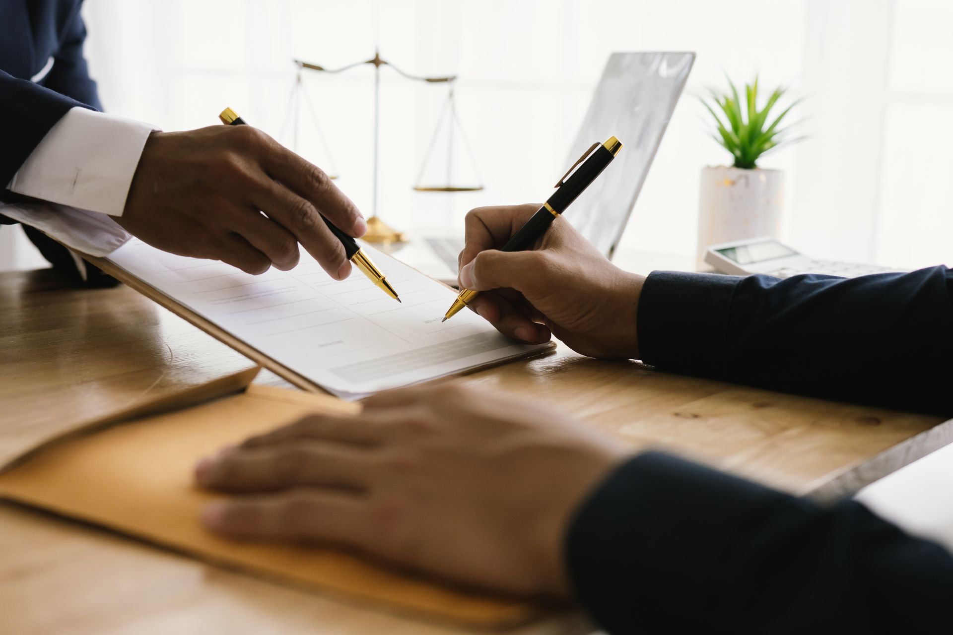 A lawyer is explaining a contract to his client. A lawyer is explaining a contract to his client.