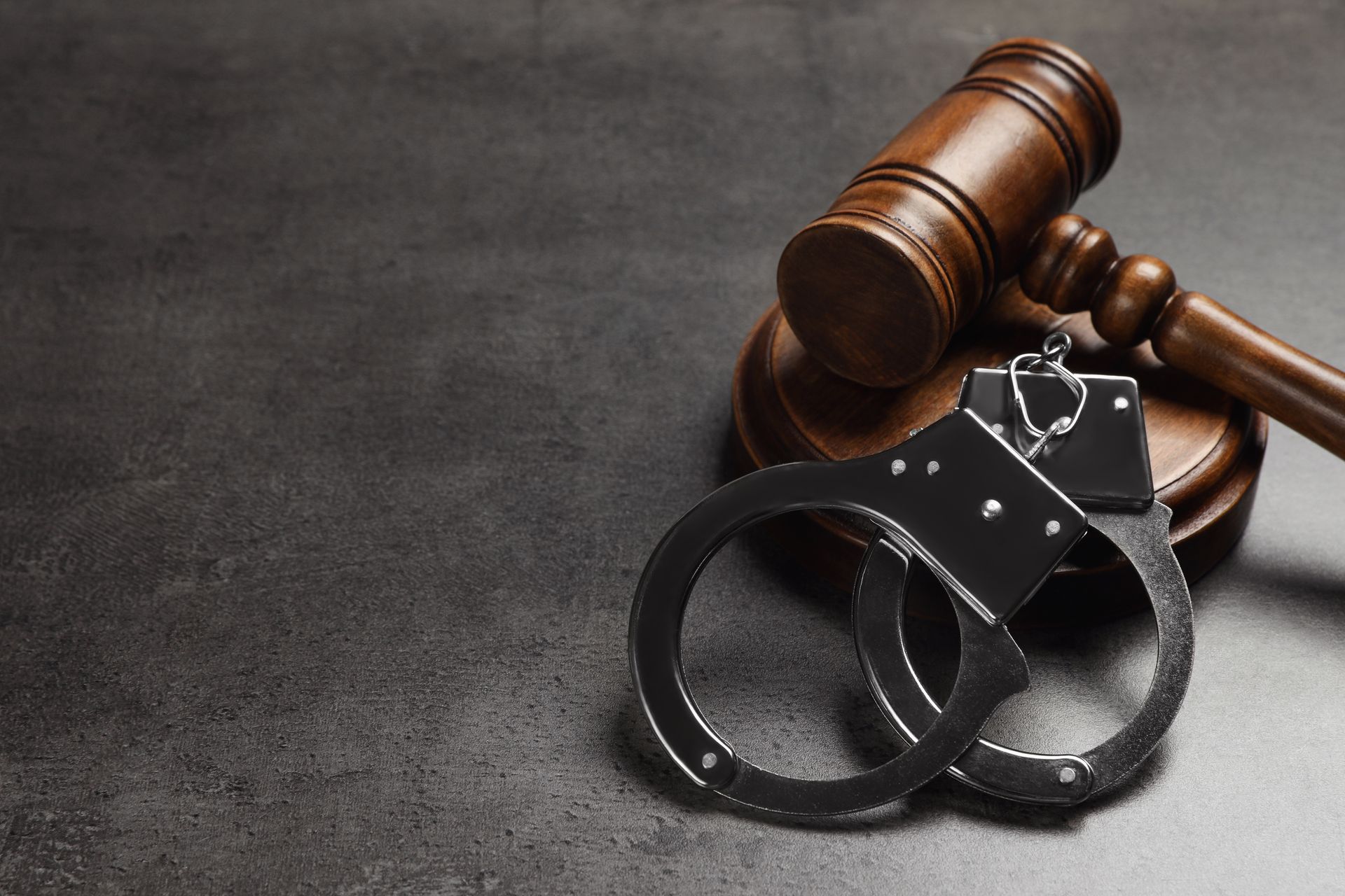 Criminal defense law attorney reviewing case documents with a client.