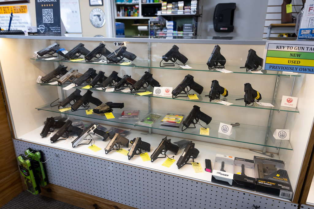 A retail case full of pistols for sale at On Target