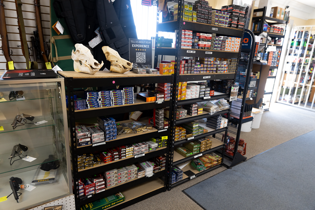store shelves filled with boxes of ammunition