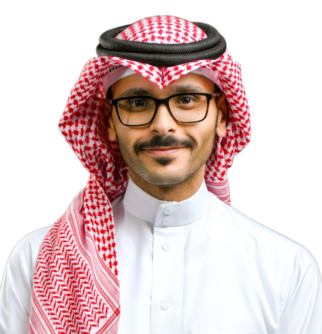 Man wearing traditional Saudi head covering and glasses smiles at camera.