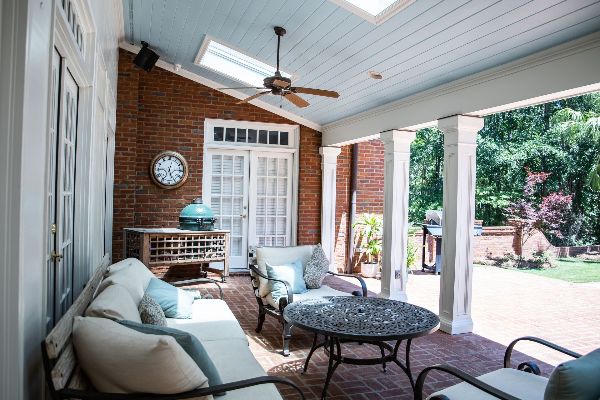 Custom Hunter Douglas window blinds for windows and doors in a chic and modern kitchen