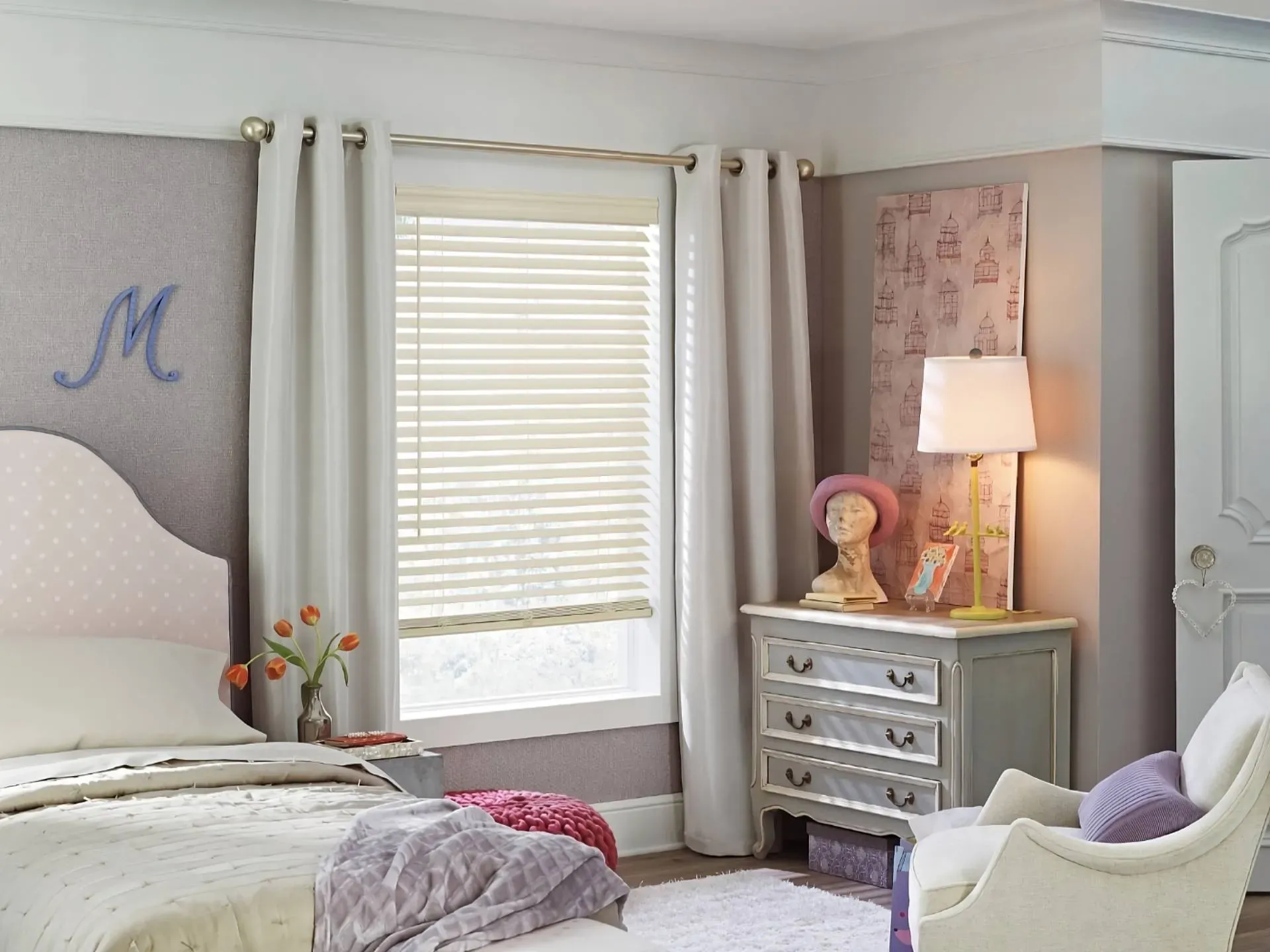 Elegant cream Hunter Douglas EverWood® Faux Wood Blinds on a window in a girl's bedroom near Seattle