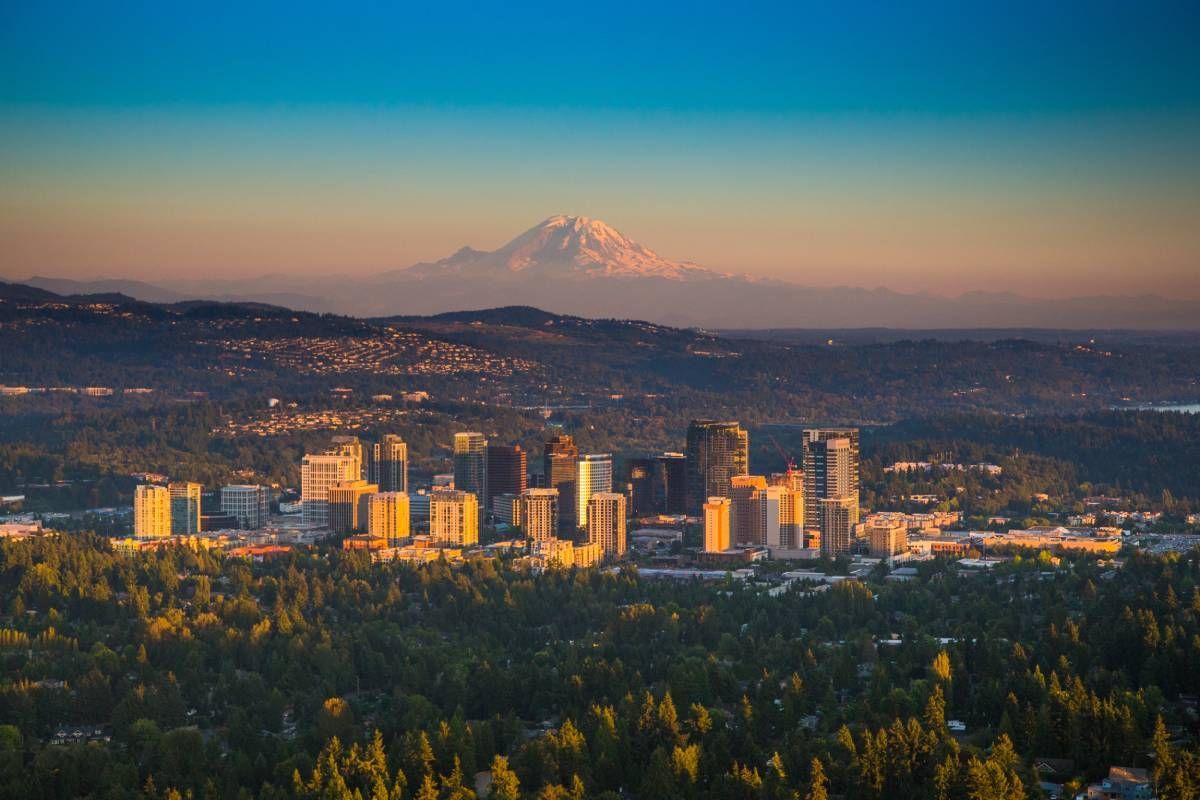 An image of downtown Bellevue, Washington, with Mt. Rainier in the background, with a gorgeous sunset