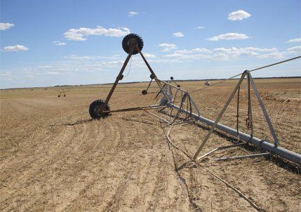 Irrigation machine on dirt field