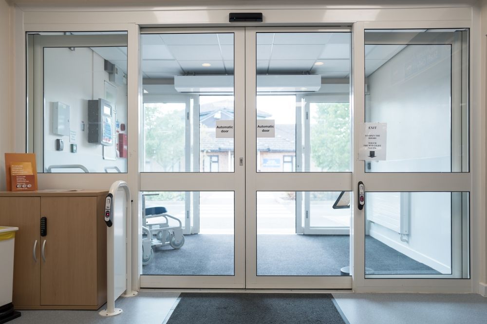 Automatic Sliding Glass Doors At A Building Entrance — CQR Locksmiths In Moree, NSW