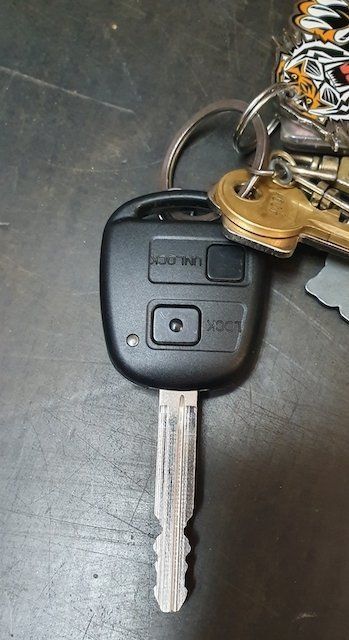 Black Car Key Fob With Buttons, Attached To A Key Ring With Other Keys — CQR Locksmiths In Moree, NSW